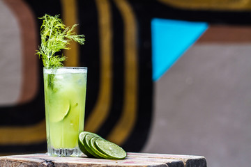 Cocktail with dill, lime and cucumber