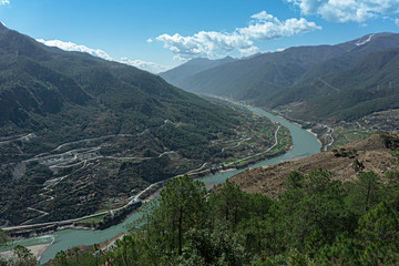 Fototapeta na wymiar The Panorama Top view Jinsha River Flowing from the Tiger Leaping Gorge it one of the deepest in the world, Lijiang, Yunnan, China