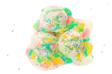 top view of white melting scoop of ice cream with rainbow glaze and sprinkles isolated on white background, summer creative concept