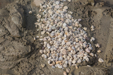 mixing concrete with gravel on construction cite