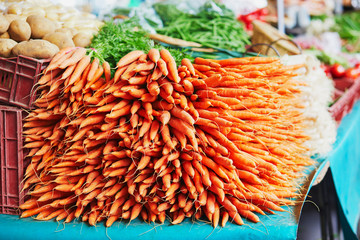 Fresh organic vegetables and fruits on farmer market in Paris, France