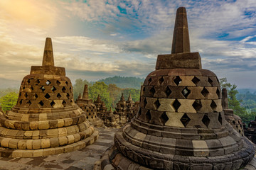 Dramatic sunrise view ancient stupa borobudur temple. the world's largest Buddhist temple and UNESCO World Heritage Site. Magelang, Yogyakarta,Central Java, Indonesia