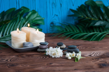 Pyramids of gray zen stones with beautiful fresh white flowers. Concept of harmony, balance and meditation, spa, massage, relax