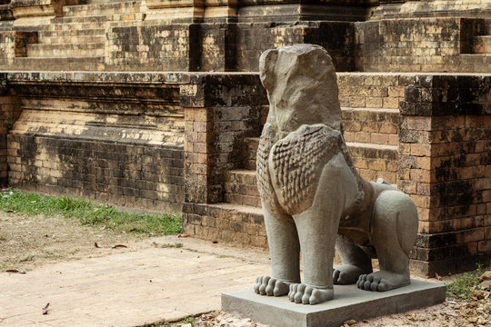 Ancient stone lion statue of Kravan temple, Angkor Wat, Cambodia. Ancient temple stone decor.