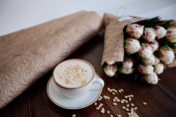Cappuccino with nuts on the table.