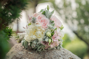 Wedding bouquet with pink roses on sunset