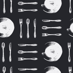 Seamless pattern of forks, spoons, plates, knifes against blackboard painted by white chalks. Background for restaurant menu. Hand drawn illustration. 