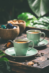 Coffee and tropical leaves background