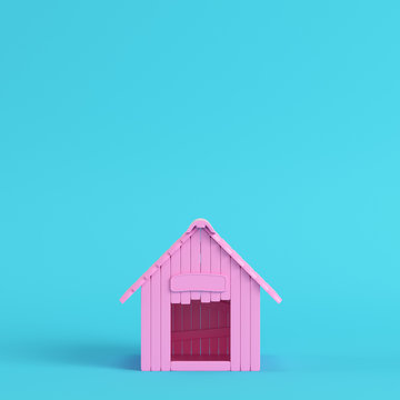 Pink doghouse on bright blue background in pastel colors