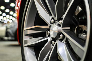 Close up of rims from a sports car. The concept of tuning the wheels of a car. Car wheel.