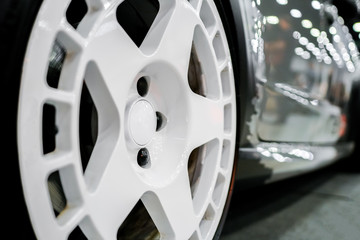 Close up of rims from a sports car. The concept of tuning the wheels of a car. Car wheel.