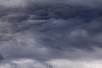 Light in the Dark and Dramatic Storm Clouds background