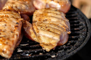 Chicken breast on the grill. Concept of street food.