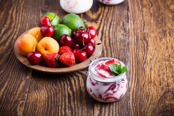Healthy breakfast with strawberry yogurt and fresh fruits