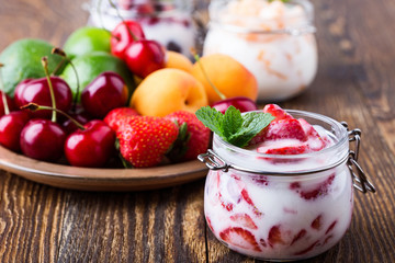Healthy breakfast with strawberry yogurt and fresh fruits