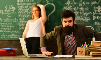 International student making individual online testing, Teacher has his own love of learningTeacher...