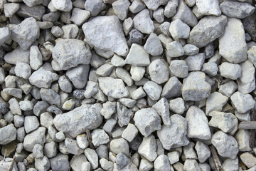 Gray and white lake gravel lies on the shore