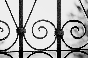 Wrought iron lattice pattern close-up.
