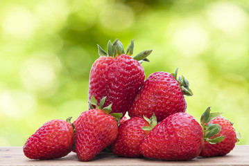 isolated strawberries on a background in wood