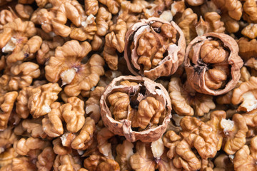 closeup of shelled and unshelled organic walnuts
