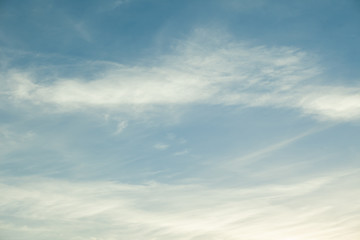 blue sky with feathery clouds sunset