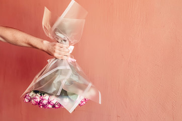 inverted color in hand. a bouquet of roses white pink. celebration. spring and summer