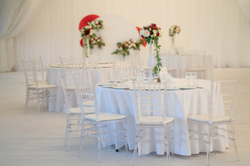 luxury airy summer restaurant in white with transparent chairs and ready to party