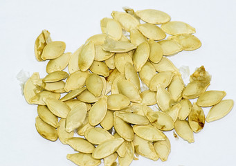 Seeds of zucchini on white background. Courgettes