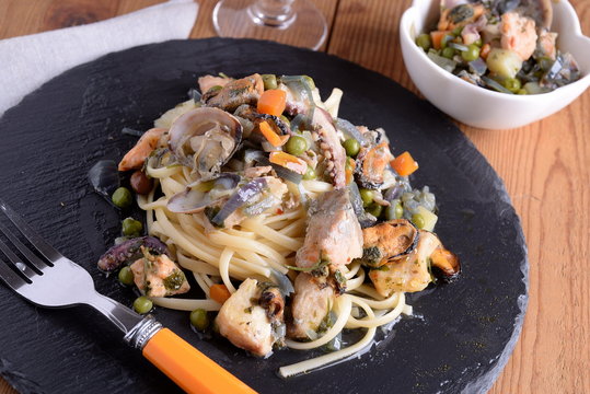 Linguine pasta with fish molluscs and crustaceans and aromas 