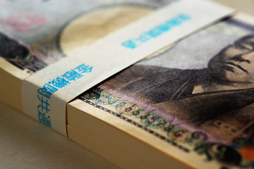 Japanese yen, stacks of green