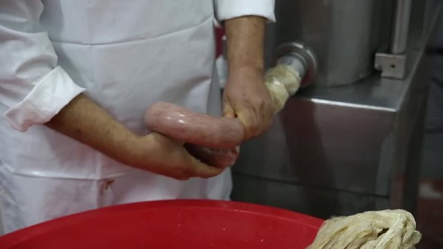 Butcher making sausages , sucuk