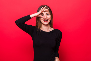 Close up portrait of woman smiling, demonstrating white teeth, looking at the camera through...