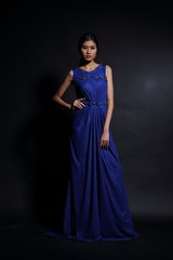 Asian woman in evening long ball dress