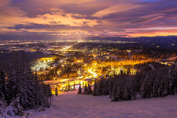 Ski Slopes And Mountain Town At Night