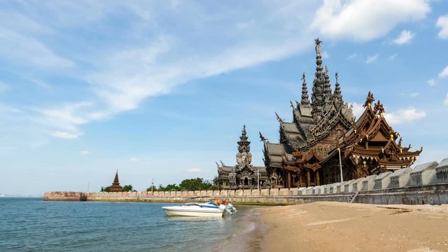 time lapse of the sanctuary of truth on the seashore in pattaya,  thailand.