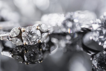 Luxury Jewelry diamond rings with reflection on black background