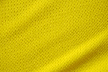 Yellow color football jersey clothing fabric texture sports wear background, close up