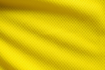 Yellow color football jersey clothing fabric texture sports wear background, close up