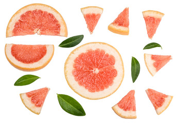 Fototapeta na wymiar Shares of sliced grapefruit isolated on white, top view