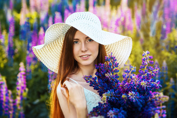 Girl posing in field flowers