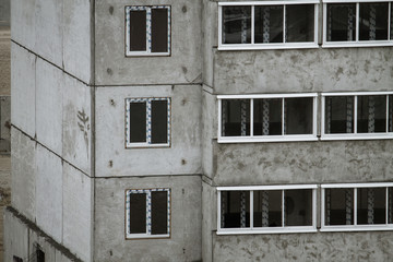 a gray concrete block of flats under construction