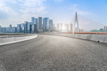 Naklejka premium Air highway asphalt road and office building of commercial building in modern city