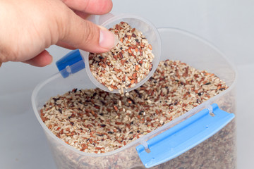 Raw brown rice isolated on white