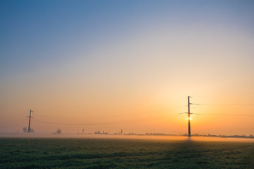 High voltage line during sunrise