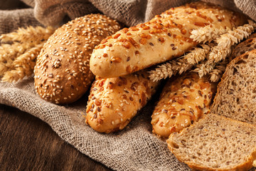 assorted bread on old wooden board