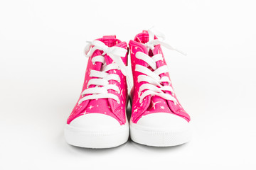 Red children's shoes. On white background.