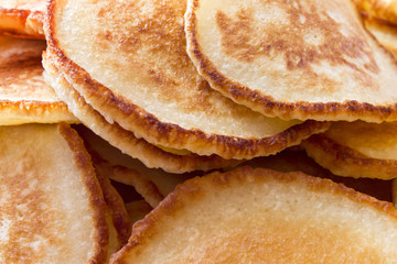 Homemade tasty pancakes for breakfast background closeup.