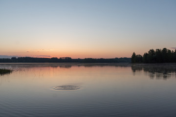 Sunrise at early morning, calm lake and water movement