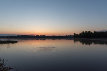 Sunrise at early morning, calm lake and water movement