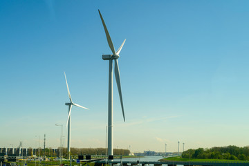 Windmills in the field. Concept of renewable energy, energy subs